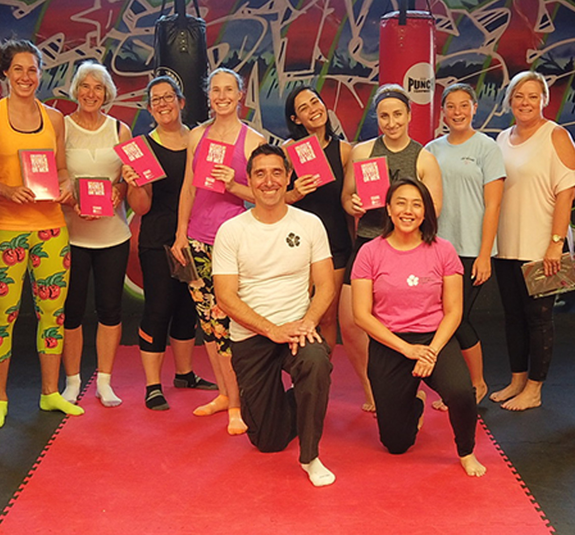 Women participating in a self-defence seminar